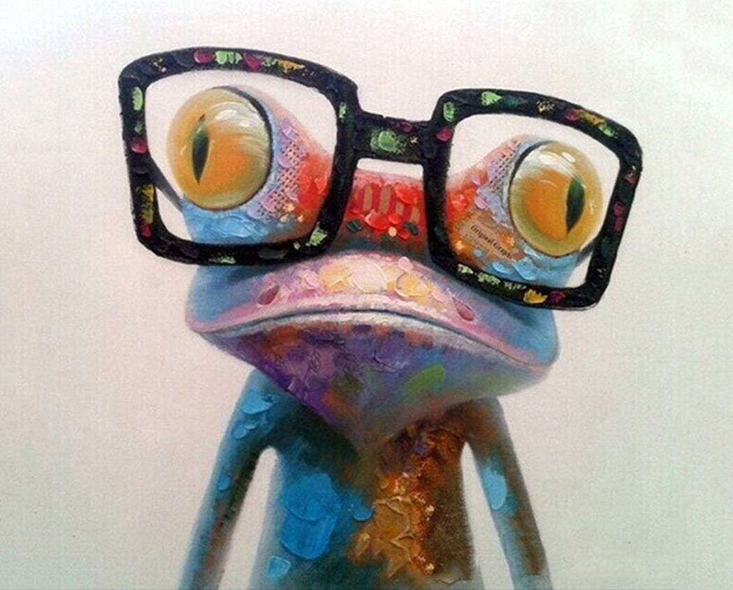 Colorful frog figurine wearing glasses on a white background