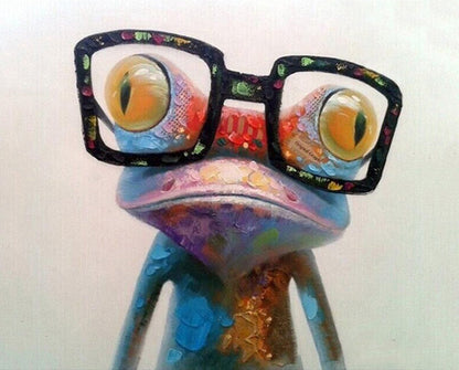Colorful frog figurine wearing glasses on a white background