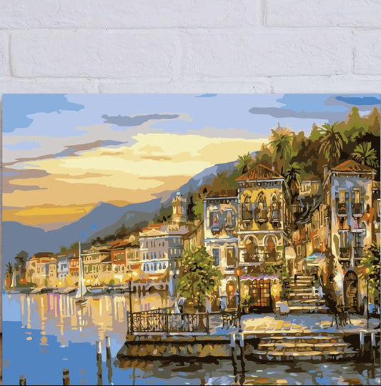 Painting of a coastal town scene with buildings and water