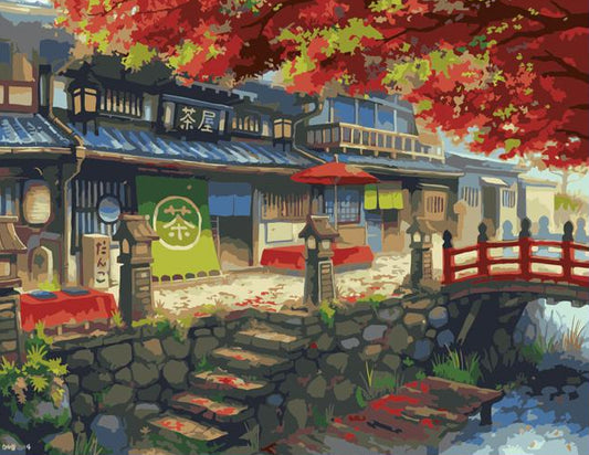 Japanese-style building with red bridge and cherry blossoms