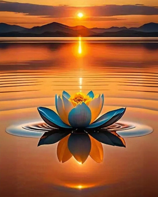 Lotus flower on water with a sunset reflection over mountains